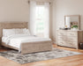 Senniberg Queen Panel Bed with Mirrored Dresser Royal Furniture